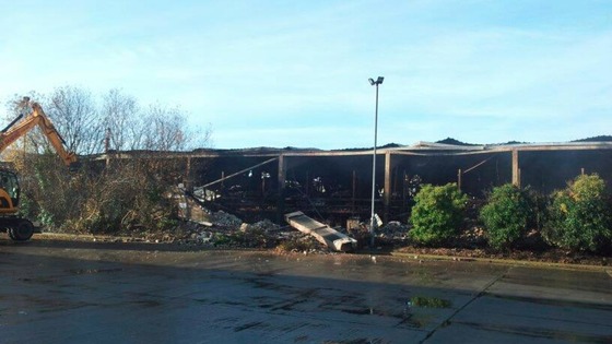 The clear-up operation begins after the fire
