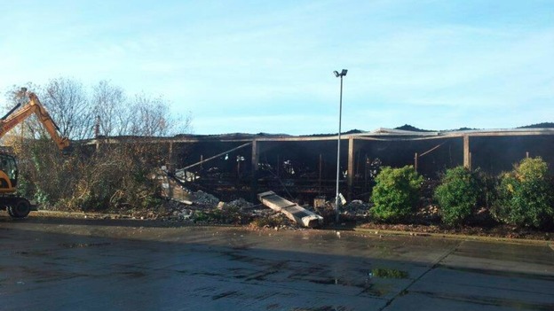 The clear-up operation begins after the fire
