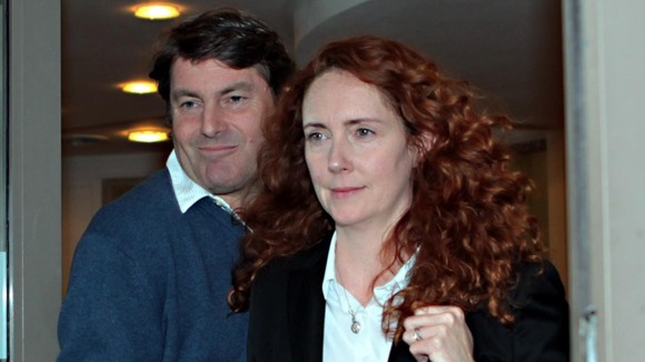 Charlie Brooks and his wife Rebekah leave their lawyers offices in London