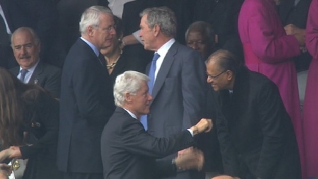 Former prime minister John Major next to former US presidents George W. Bush and Bill Clinton