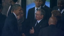 Historic handshake between Obama and Castro at memorial