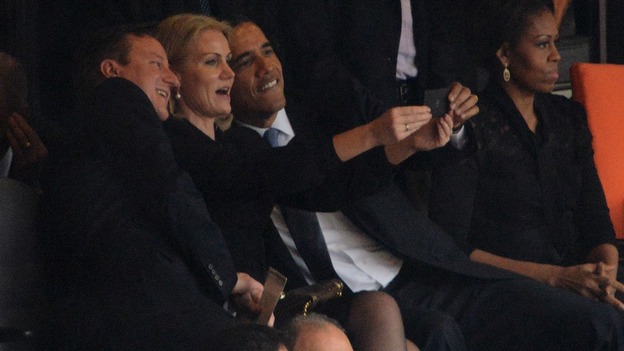 President Obama, David Cameron and Helle Thorning-Schmidt take a picture of themselves during the memorial.