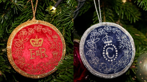The specially-made royal trinkets hung on the tree by the Queen and Camilla.