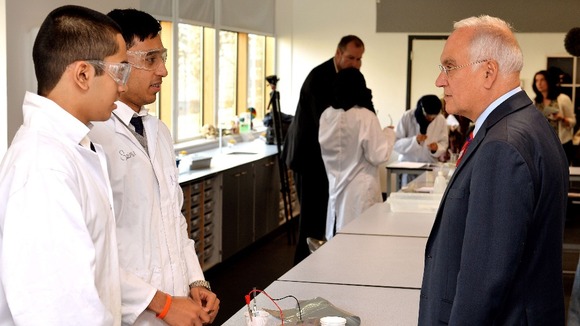 Ofsted chief inspector Sir Michael Wilshaw talks to students in east London.