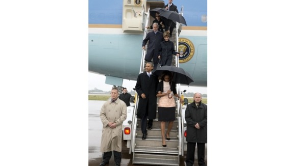 President and Mrs. Obama, former President and Mrs. Bush, and former Secretary of State Hillary Clinton arrive in South Africa.