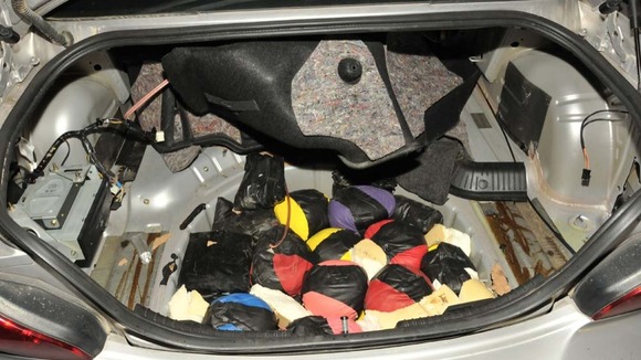The Heroin was stored in several areas, including the car's spare wheel compartment.