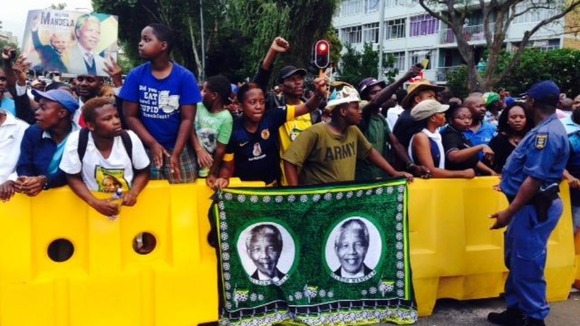 The crowd had been dancing and shouting 'Viva' as they waited to see Nelson Mandela.