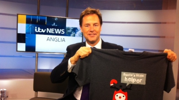 Deputy Prime Minister Nick Clegg poses with a Text Santa t-shirt.