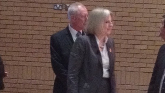 Theresa May enters conference hall 