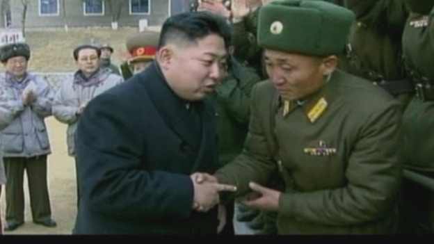 Jang Song-thaek can be seen behind Kim Jong-un without a hat.