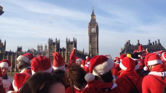 Santacon revellers congregate near the Palace of Westminster for their annual celebration