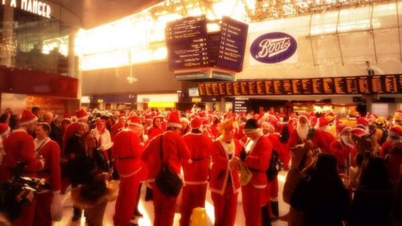 Santacon revellers gather at Waterloo station, as snapped by ITV News weather presenter Lucy Verasamy
