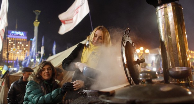 Volunteers distribute free tea at a pro-European integration protesters' camp at Independence Square.