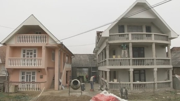 Men work on a building.