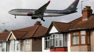 A Royal Jordanian airways jet arrives over the top of houses to land at Heathrow Airport in west London.