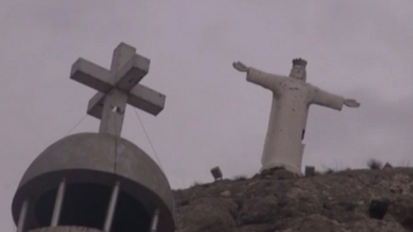 The statue of Christ that overlooks the road leading to Maaloula