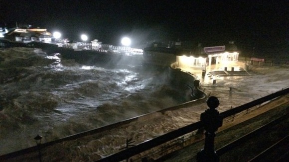 Cromer Pier hit by the storm surge.