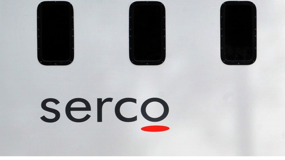File photo of a prison van with Serco's logo on the side.