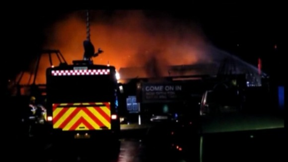 Firefighters tackle the blaze.