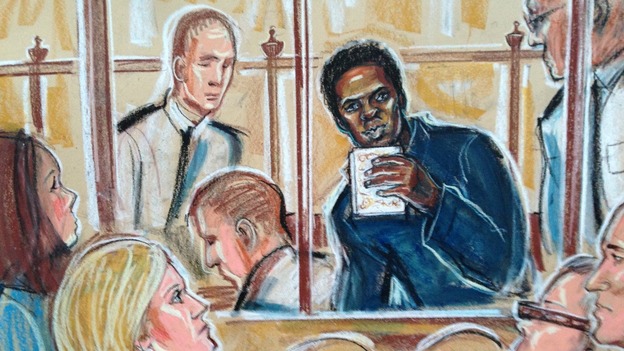 Michael Adebolajo kisses the Koran at the Old Bailey
