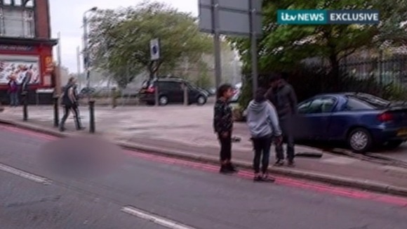 Two women  try to reason with one of Lee Rigby's murderers in the immediate aftermath of the attack