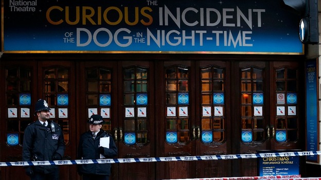 Police stand outside the Apollo Theatre on Shaftesbury Avenue in central London.