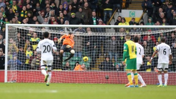 Swansea City's Michel Vorm is powerless to stop Hooper's unstoppable strike.
