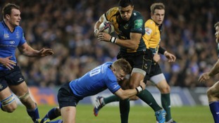 Luther Burrell attempts to break through the Leinster defensive line.