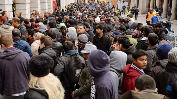 People queue outside the Apple shop in London in September to purchase the new iPhone.