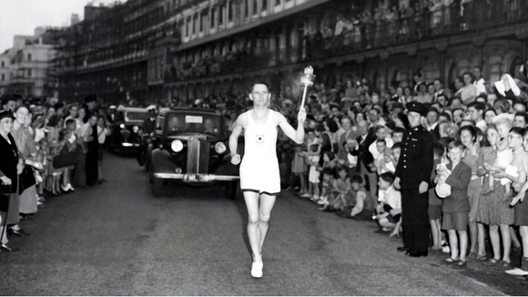 Petty Officer (Barney) Barnes, bearing the Olympic along Dover Front on the first stage of its journey to Wembley