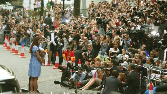 A swarm of international press photographers and cameras greeted the couple as they left hospital.