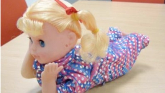 One of the 'crawling'-style baby dolls