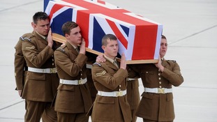 Soldiers carrying coffin