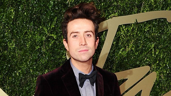 Radio 1 DJ Nick Grimshaw wearing a bow tie and a suit.