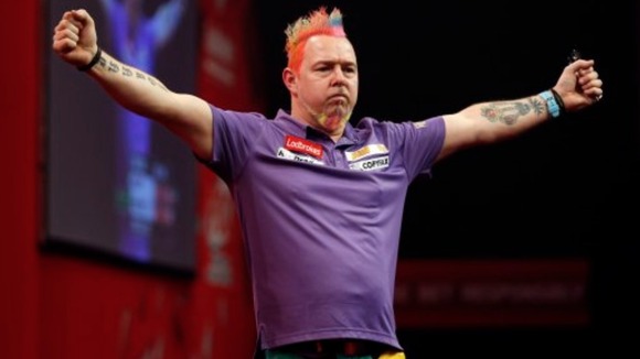 Peter Wright celebrates his 6-2 win over Simon Whitlock.