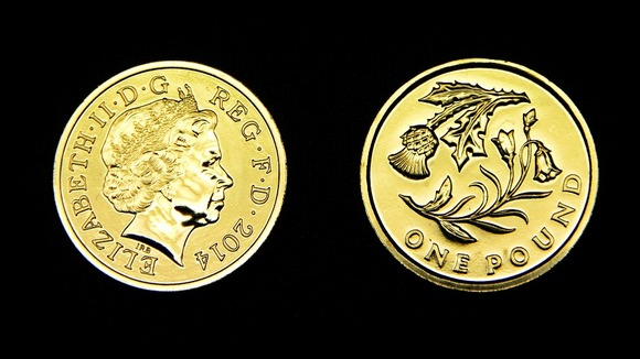 A £1 coin featuring an Scottish thistle.