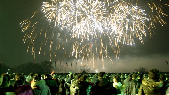Revellers in North Korea watch the fireworks display.