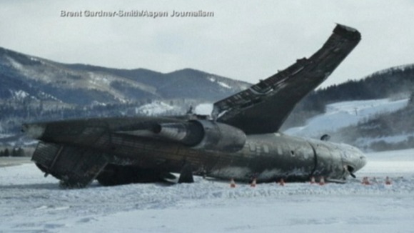 The private jet lies on its roof on the runway