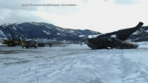 The runway appears to be coated in ice and snwo
