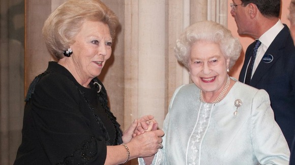 Queen Elizabeth II greets the Queen of the Netherlands at the Jubilee lunch