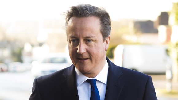 David Cameron's hair stylist has said he earned his MBE.
