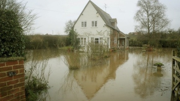A flooded property near Apperley in Gloucestershire