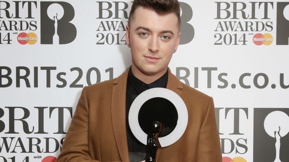 Sam Smith holds his Critics' Choice Brit Award heading to today's nominations launch event.