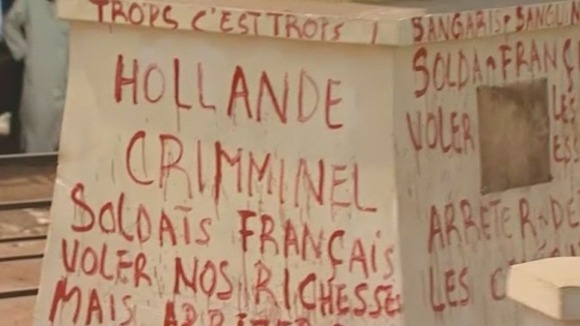 Graffiti accuses the French of coming to steal CAR's riches.