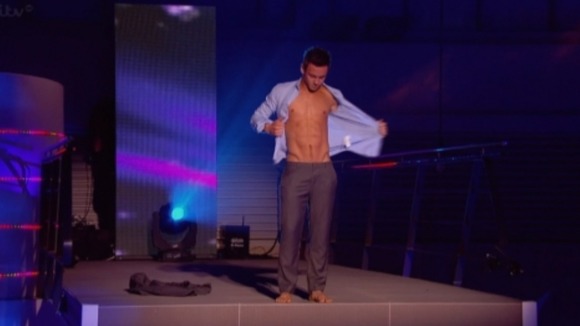 Tom stripped off his shirt before diving from the 10m board.