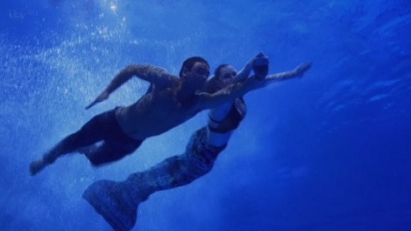Tom swam with some mermaids on Splash.
