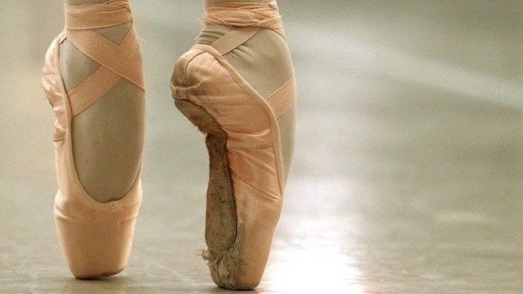 File photo of a ballerina in pink ballet shoes.