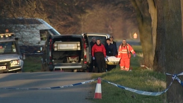 Police and forensic experts at the scene where two of the bodies were found