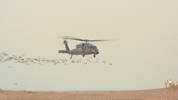 The undamaged Pave Hawk leaves the shingle bank