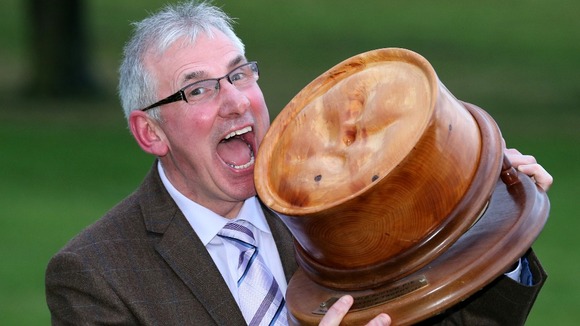 World Scotch Pie Champion Stephen McAllister poses with his prize